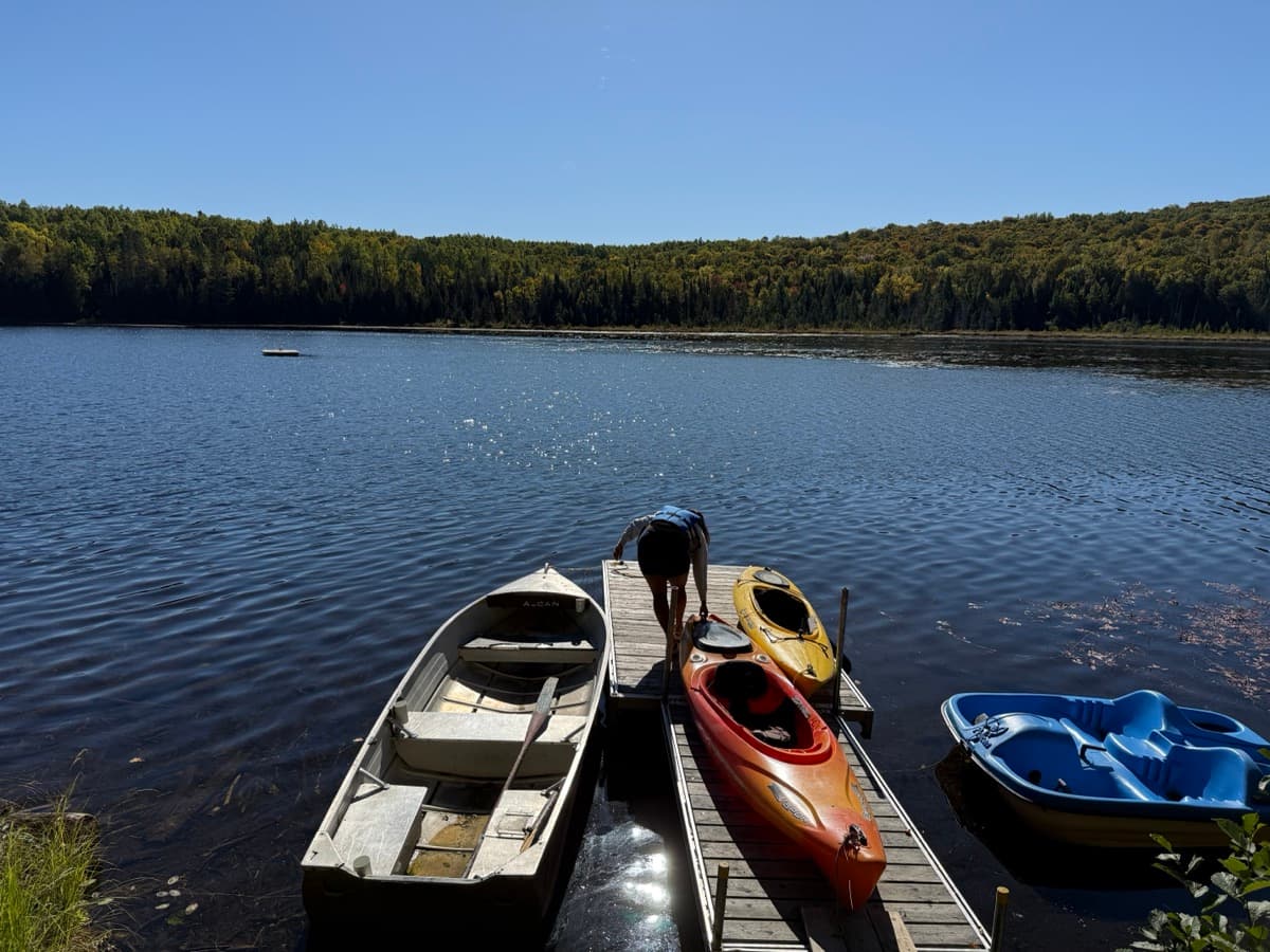 Kayaks tied up at a lake dock